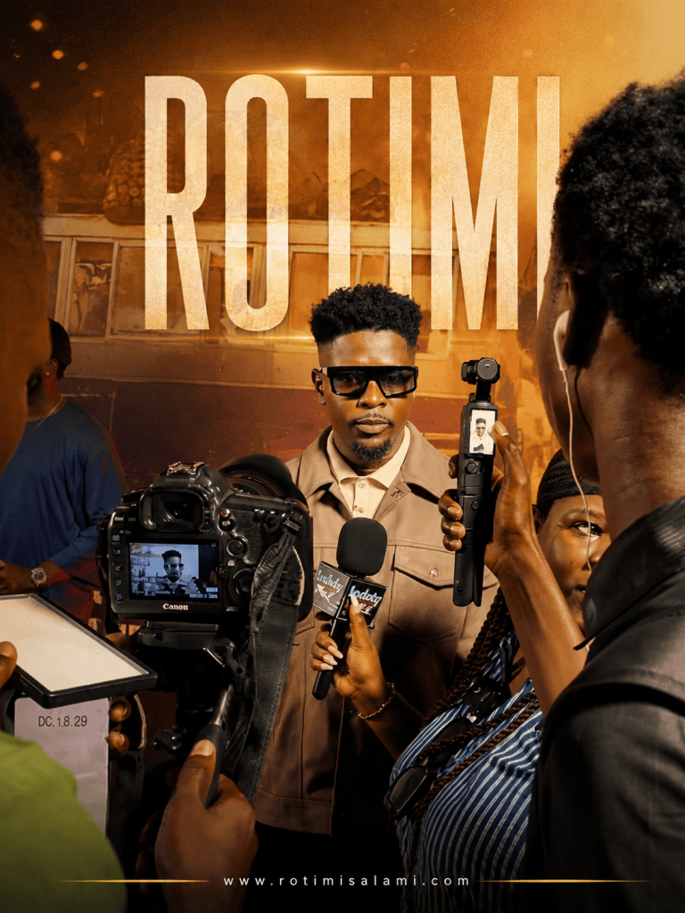 Rotimi Salami speaks with entertainment journalists during the NJEM movie premiere.